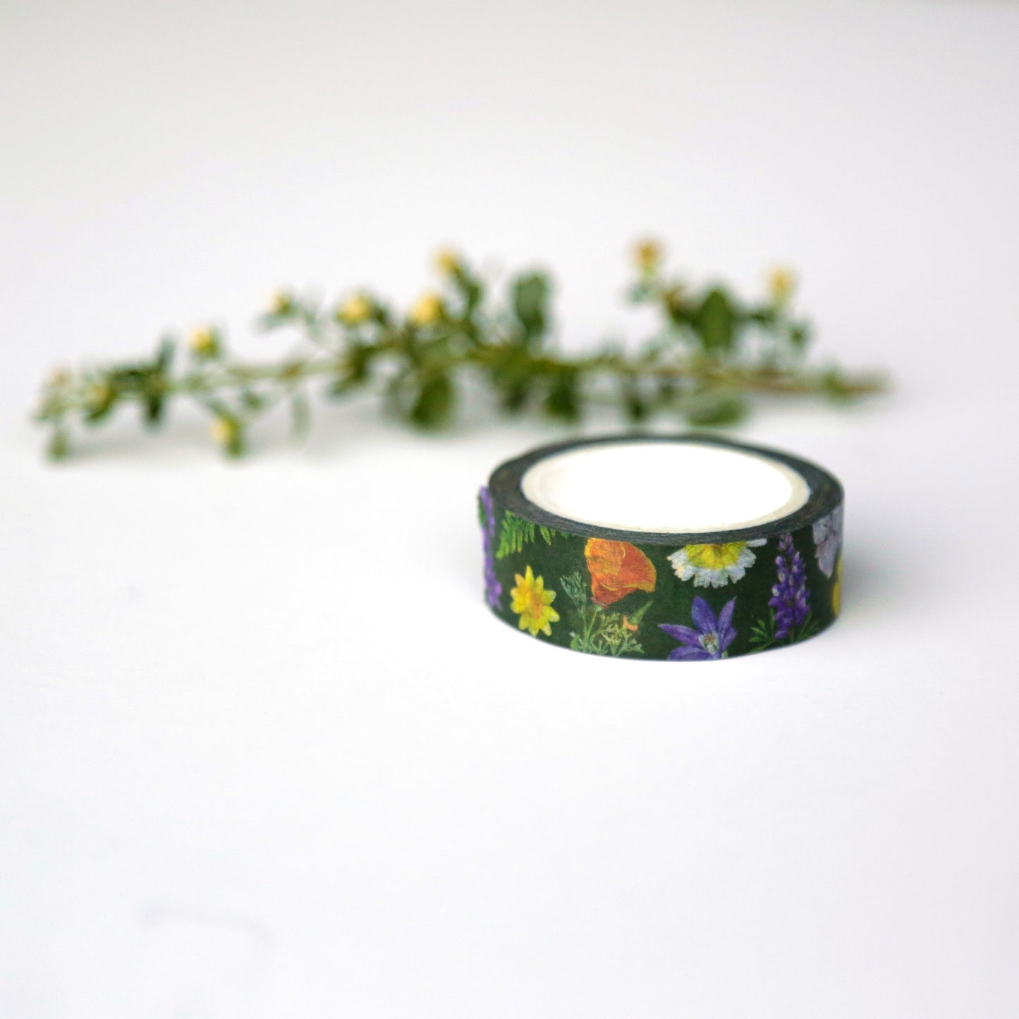 Roll of dark green tape printed with various native wildflowers.