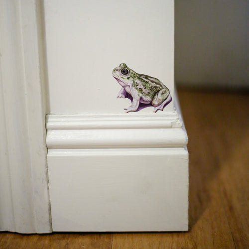 Load image 1 in gallery view. Realistic Spadefoot Toad on a white wall sitting above a baseboard.