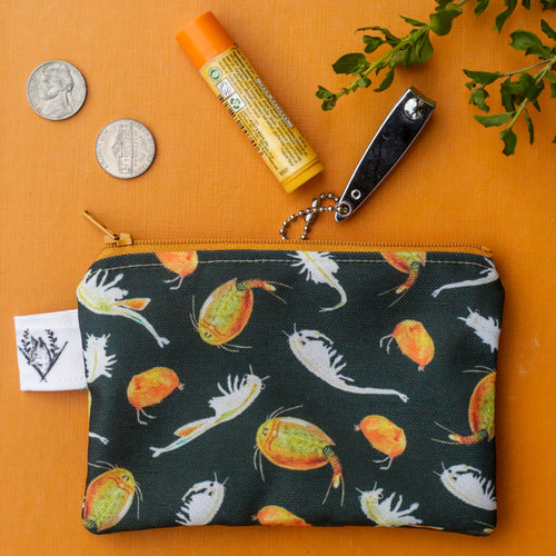 Load image 1 in gallery view. A black pouch with a pattern of grassland shrimp and an orange zipper on an orange background. 