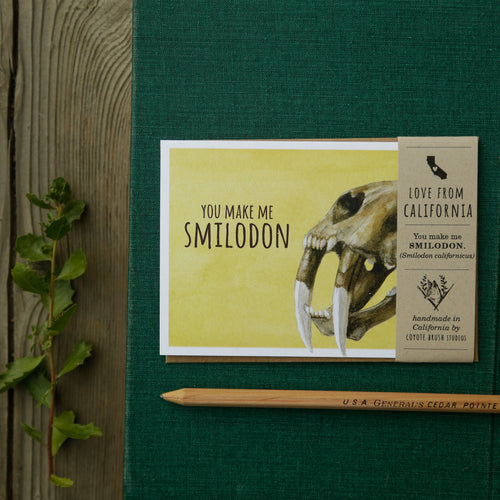 Load image 1 in gallery view. You make me SMILOdon! - California Saber-Tooth Cat Greeting Card