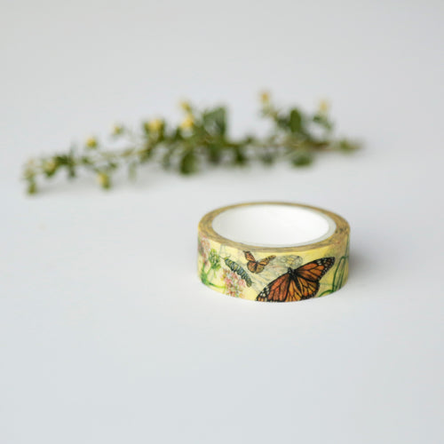 Load image 1 in gallery view. Roll of pale yellow tape printed with monarch butterflies.