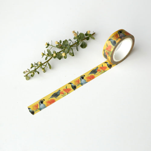 Load image 1 in gallery view. Bright yellow tape partially unrolled to show illustrations of poppy and quail printed on it.